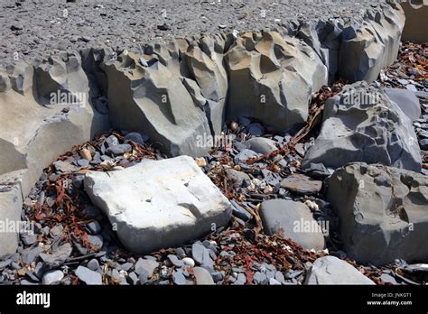 Geological Cliff Structures With Limestone And Soft Crumbling Oil