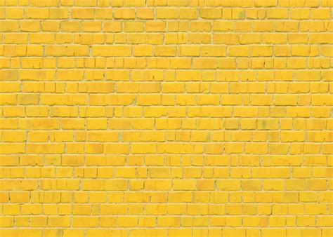 premium photo brick background yellow colour