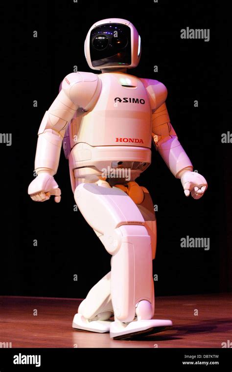 Honda's ASIMO robot performs walking, running, dancing, climbing stairs, and kicking a soccer ...