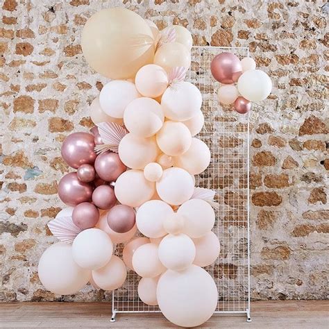 Arche De Ballons Pêche Et Rose Gold Avec Feuillage