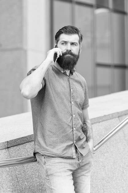 Premium Photo His Smartphone Is Sleek And Luxury Bearded Man Talk On