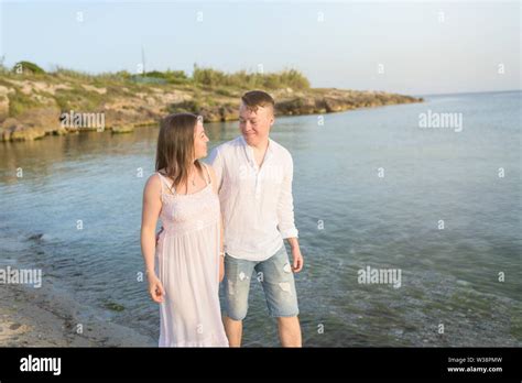 Happy Romantic Middle Aged Couple Enjoying Beautiful Sunset Walk On The