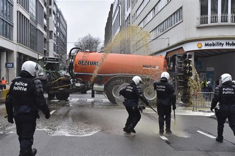 Protesting Farmers Spray Brussels Police With Liquid Manure near EU's