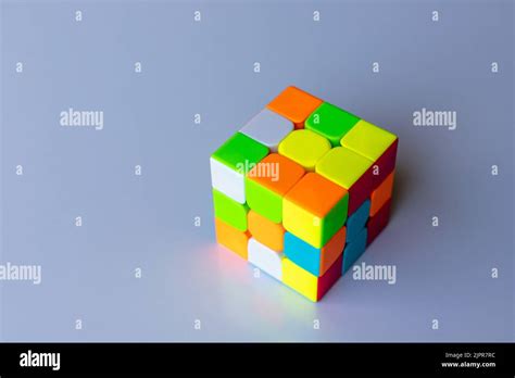 Unsolved Rubik Magic Cube On A White Isolated Background Stock Photo