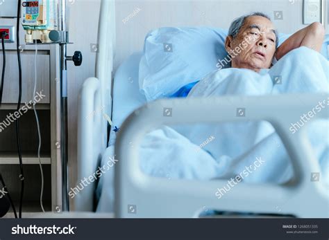 Sad Senior Man Lying On Hospital Bed Images Stock Photos Vectors