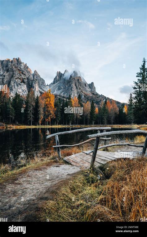 Autumn Colours Of Lake Lago D Antorno And Bridge In Dolomites Italy