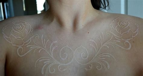 White ink roses tattoo on chest - Tattooimages.biz