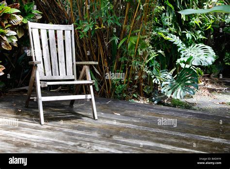 rustic chair in rural garden setting Stock Photo - Alamy