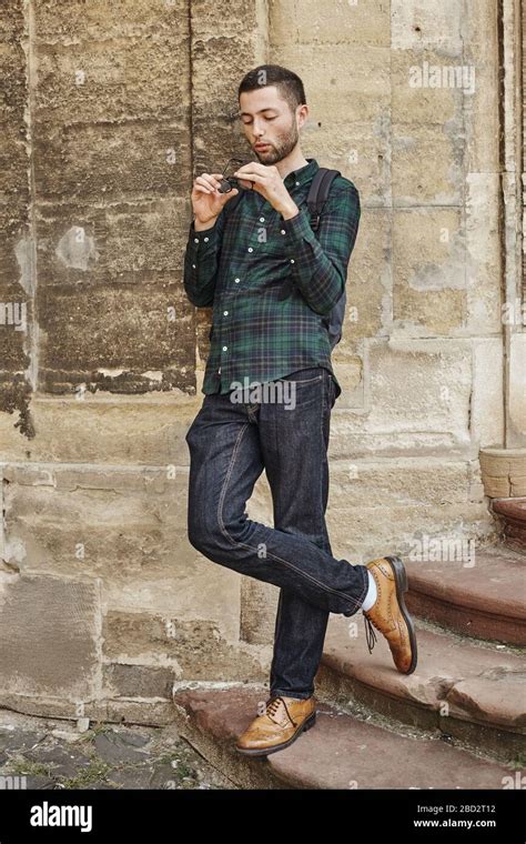 Portrait of beautiful young man in classic round glasses Stock Photo ...