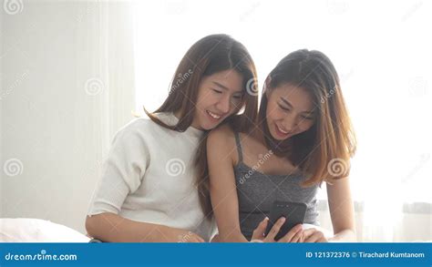 Beautiful Young Asian Women Lgbt Lesbian Happy Couple Sitting On Bed