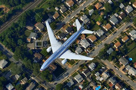 OverflightStock Boeing 777 200 Airplane From Above Aerial Stock Photo