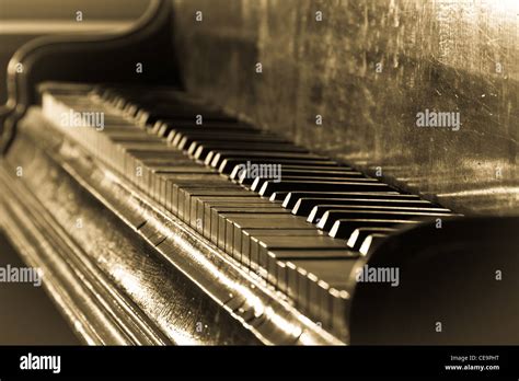 Antique Piano And Sepia Toned Stock Photo Alamy