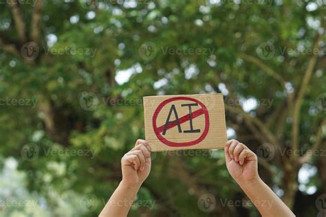 Close up hand holds paper card with No AI, prohibition sign, outdoor