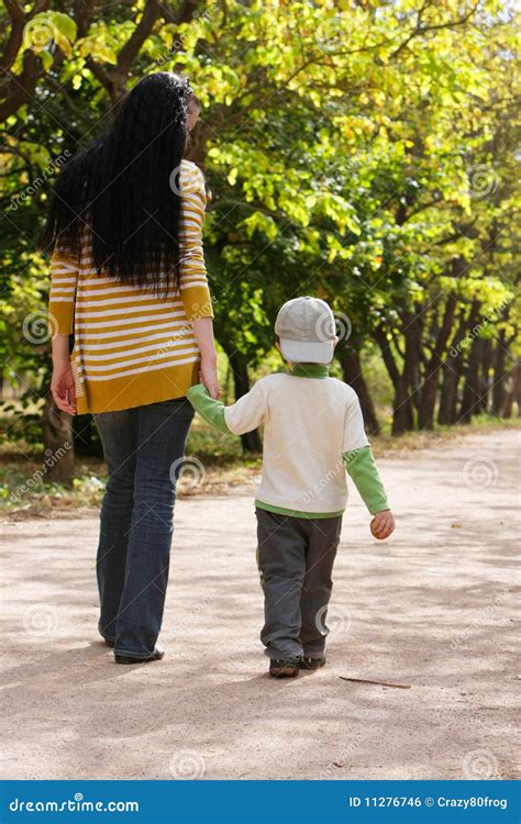 Mother And Son Walking In Park Stock Photo Image Of Cheerful