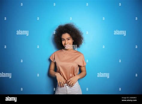 Attractive African American Woman Posing On Color Background Stock