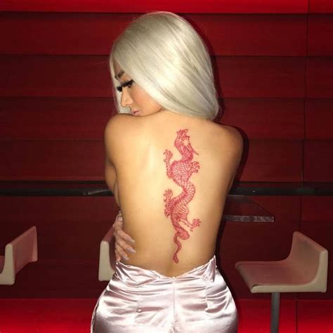 A Woman With A Dragon Tattoo On Her Back