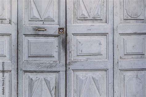 Old Gray Wooden Entrance Door With Metal Lock Of An Ancient Italian