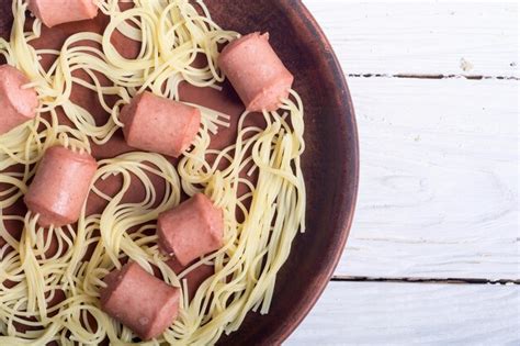 Premium Photo Pasta Spaghetti With Sausage On Rustic Background