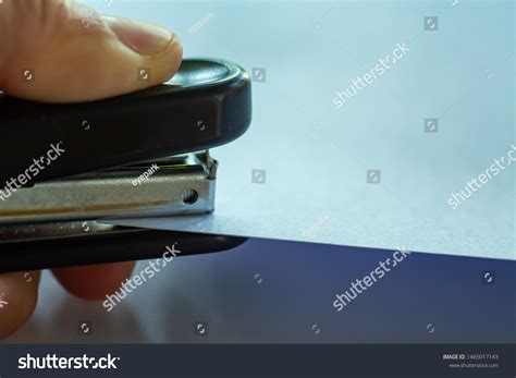 Womans Left Hand Holding Stapler Stapling Stock Photo Edit Now 1465017143