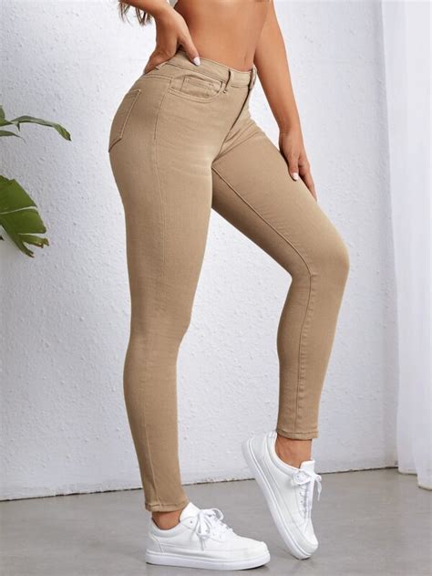 SHEIN Essnce Jeans Ajustados Con Bolsillo Oblicuo Moda De Mujer