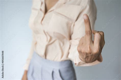 rude  impolite gesture concept image hand  asian woman showing