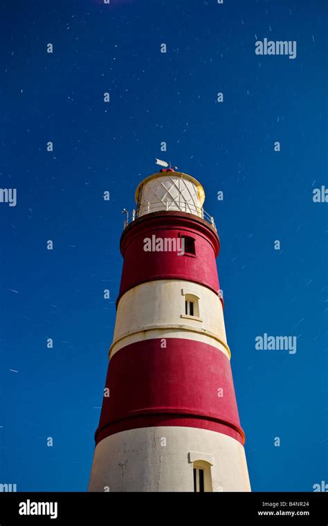 Happisburgh lighthouse photographed at night during a long exposure on the Norfolk Coast Stock ...