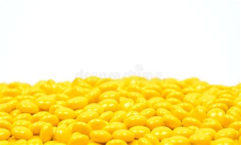 Yellow Sugar Coated Tablets Pills on White Background Stock Image ...