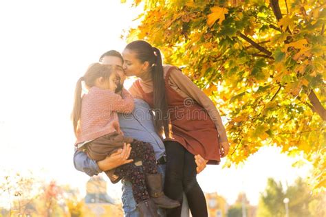 Family Walking in Autumn Park at Sunset Stock Image - Image of ...