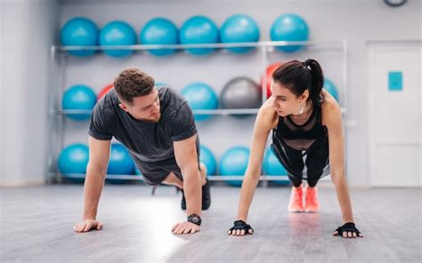 Premium Photo Attractive Couple Pushing Off The Floor And Looking At