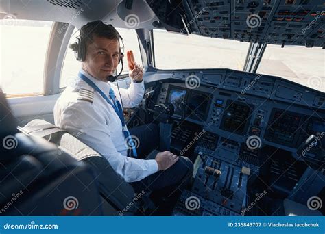 Male Plane Captain Giving Two-finger Salute To Camera Stock Image ...