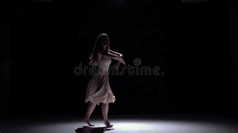 Modern Dancer Girl In Dark Dress Dancing Contemporary On Black Shadow