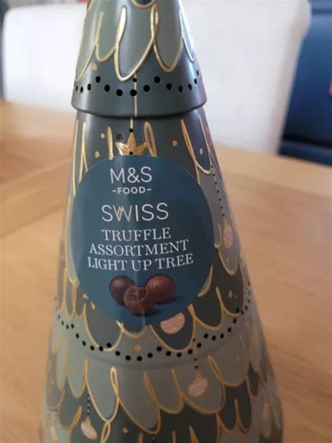 MARKS AND SPENCERS Christmas Tree Light Up Tin With Chocolates 10 00