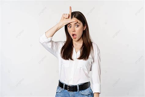 Woman Taunts Loser With L Sign Against White Background Photo And