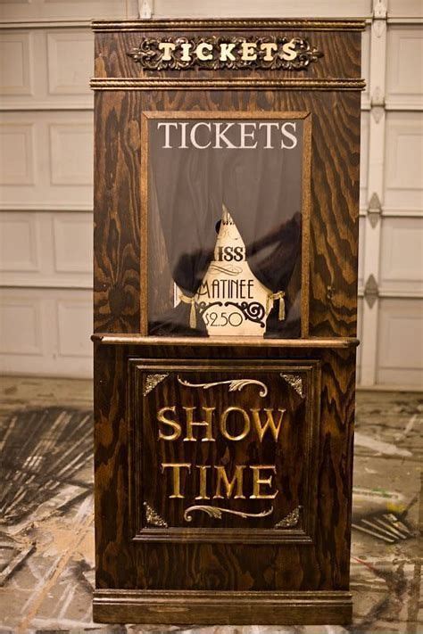 An Old Fashioned Ticket Machine Sitting In Front Of A Garage Door With