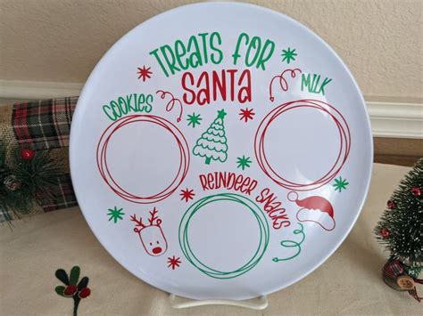 A White Plate With Red And Green Designs On It Sitting Next To A