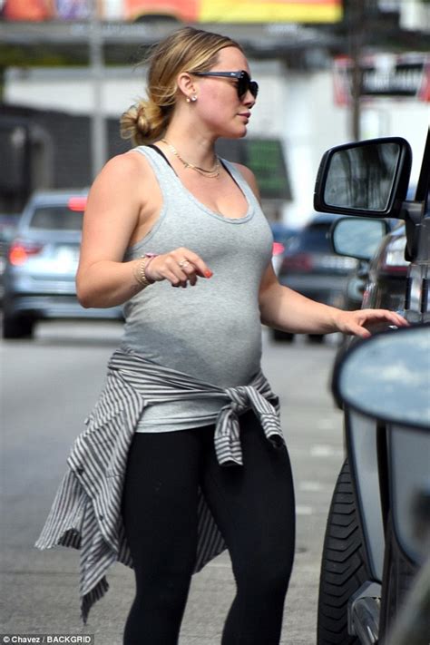 Hilary Duff Shows Off Her Growing Baby Bump In Fitted Gray Top With