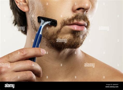 Man With Unkempt Beard Before A Shaving Routine Stock Photo Alamy