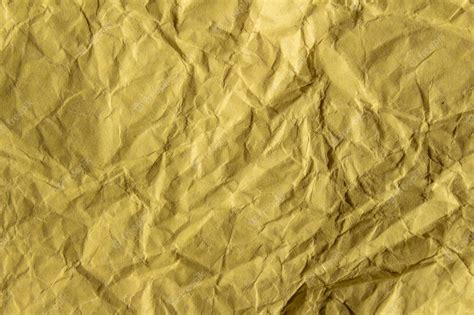 Premium Photo Crumpled Yellow Paper Texture Background