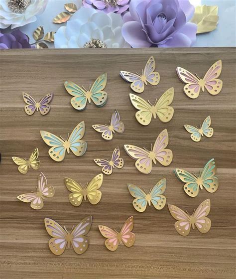 A Bunch Of Butterflies Sitting On Top Of A Wooden Table Next To Some