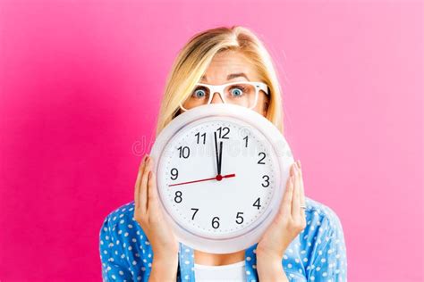 Woman Holding Clock Showing Nearly Stock Image Image Of People