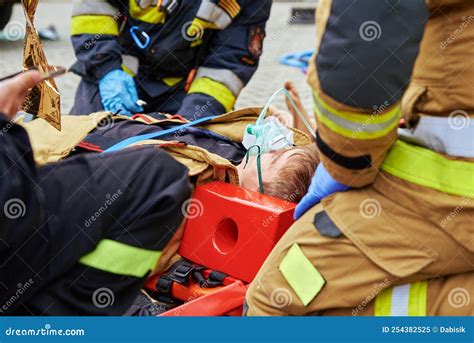 Rescuers Provide First Aid To the Victim during Car Road Accident Editorial Image - Image of ...