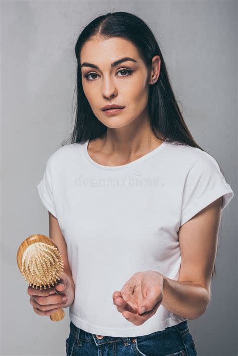 An Old Hairbrush With Fallen Hair On A Black Background Hygiene And