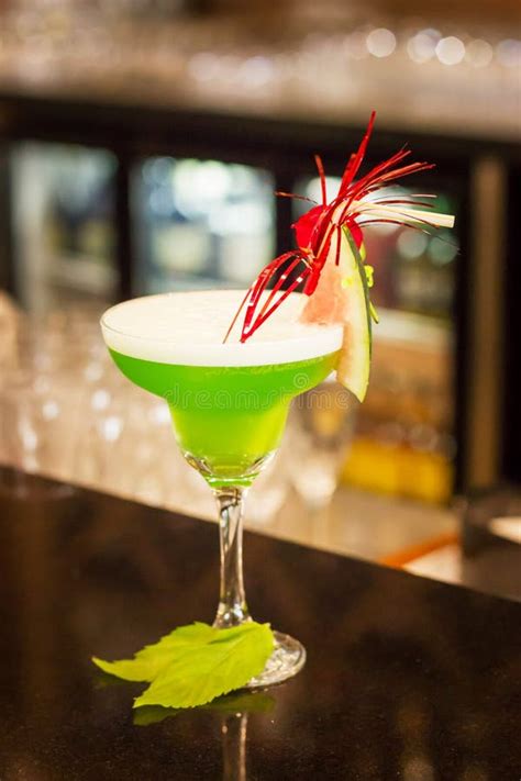 Green Alcoholic Cocktail With Mint In A Margarita Glass On A Bar Counter Stock Image Image Of