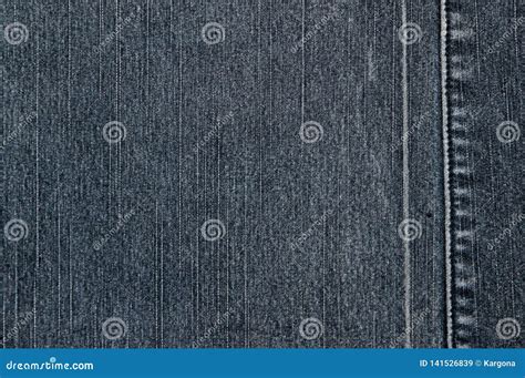 Texture Of A Gray Denim Fabric Two Pieces Of Fabric Stitched Together