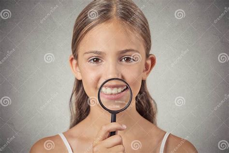 Girl Showing Teeth Through A Magnifying Glass Stock Image Image Of