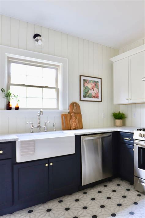 Farmhouse kitchen sink with vertical paneling shiplap backsplash ...