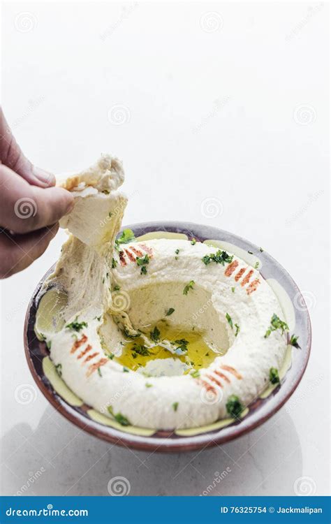 Hummus Or Houmous Appetizer Made Of Mashed Chickpeas Tahini Lemon