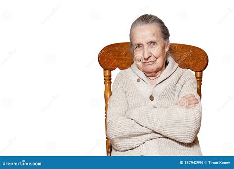 Portrait Of Gray Haired Elderly Woman Grandmother Sitting On Vintage