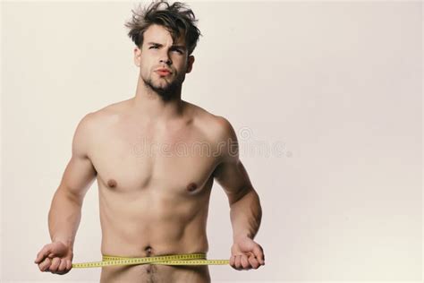 Sports And Weight Loss Concept Man With Long Yellow Tape Measure