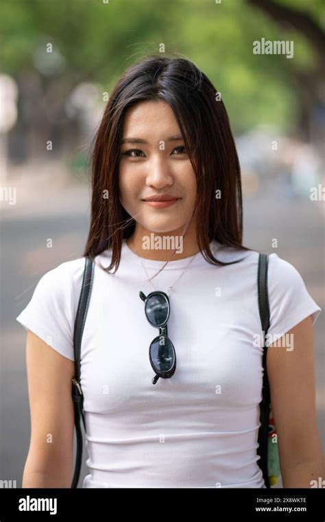 Street Portrait Of Young Beautiful Chinese Teenage Girl In The Streets